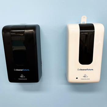 The Cleaner Future Soap Dispenser in Black and White on a blue background